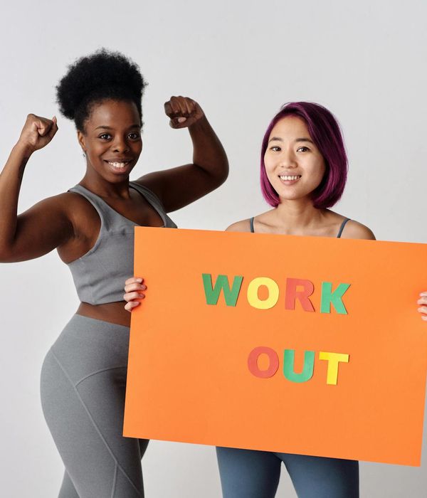 Woman feeling energetic and vibrant during a light cardio workout in a modern studio.